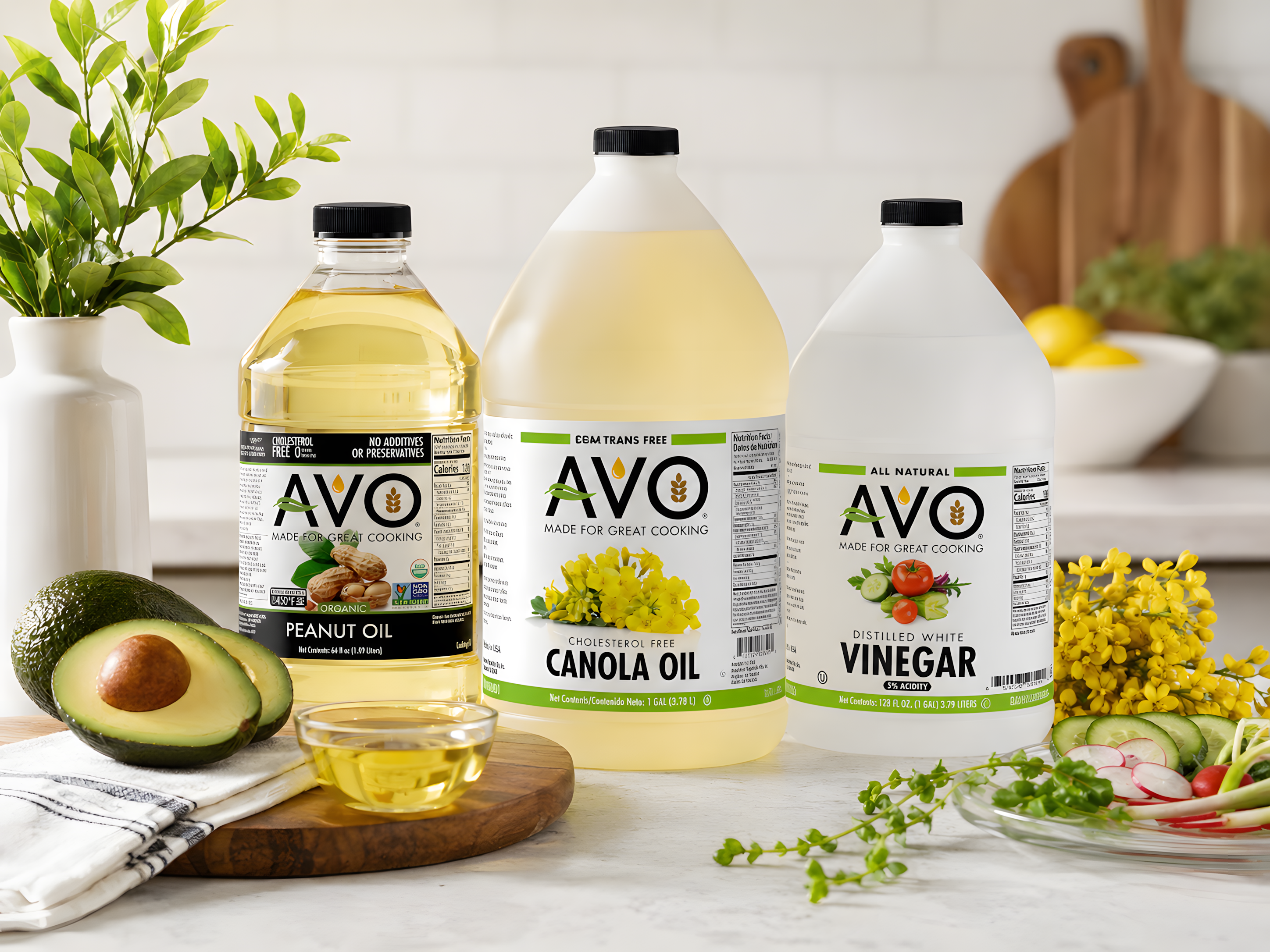 AVO cooking oil and vinegar packaging displayed in a kitchen setting